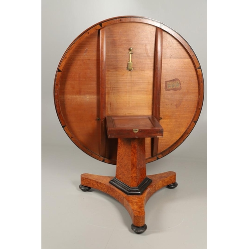 478 - A REGENCY AMBOYNA BREAKFAST TABLE, CIRCA 1815. the circular tilt top with ebonised lower rim upon a ... 