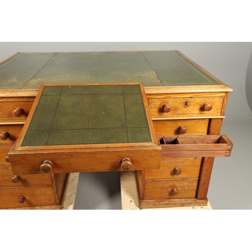 483 - A LATE 19TH CENTURY OAK PARTNERS DESK. the top inset with gilt tooled green leather over an arrangem... 