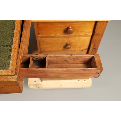 483 - A LATE 19TH CENTURY OAK PARTNERS DESK. the top inset with gilt tooled green leather over an arrangem... 