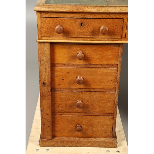 483 - A LATE 19TH CENTURY OAK PARTNERS DESK. the top inset with gilt tooled green leather over an arrangem... 