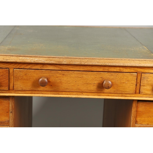 483 - A LATE 19TH CENTURY OAK PARTNERS DESK. the top inset with gilt tooled green leather over an arrangem... 