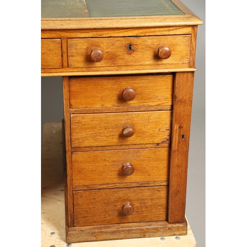 483 - A LATE 19TH CENTURY OAK PARTNERS DESK. the top inset with gilt tooled green leather over an arrangem... 