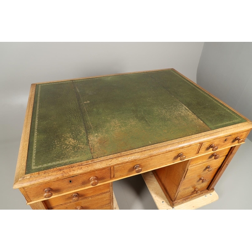 483 - A LATE 19TH CENTURY OAK PARTNERS DESK. the top inset with gilt tooled green leather over an arrangem... 