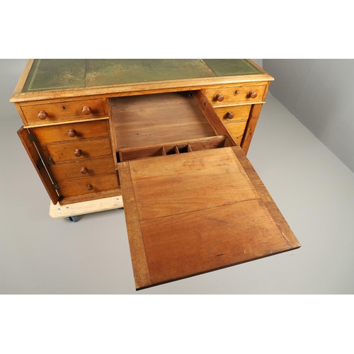 483 - A LATE 19TH CENTURY OAK PARTNERS DESK. the top inset with gilt tooled green leather over an arrangem... 