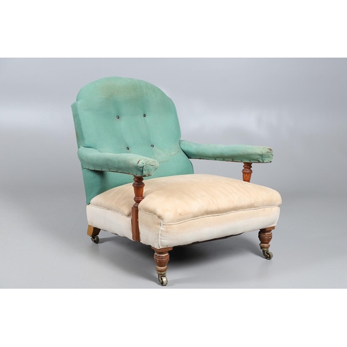 484 - A LATE 19TH CENTURY DEEP SEATED PITCH PINE ARMCHAIR. the front brass casters stamped Howard & Sons, ... 