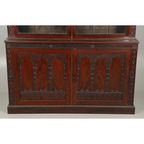 487 - A REGENCY MAHOGANY LIBRARY BOOKCASE, POSSIBLY IRISH. with later carved Gothic style decoration, incl... 