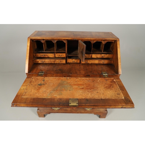 488 - AN 18TH CENTURY INLAID WALNUT BUREAU. with crossbanding and herringbone inlay, the fall front enclos... 