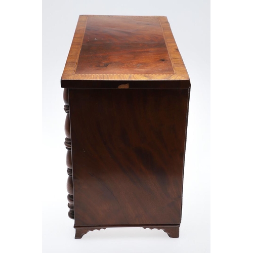 489 - A MAHOGANY TABLE TOP CHEST OF DRAWERS. the crossbanded top with herringbone inlay over four drawers ... 