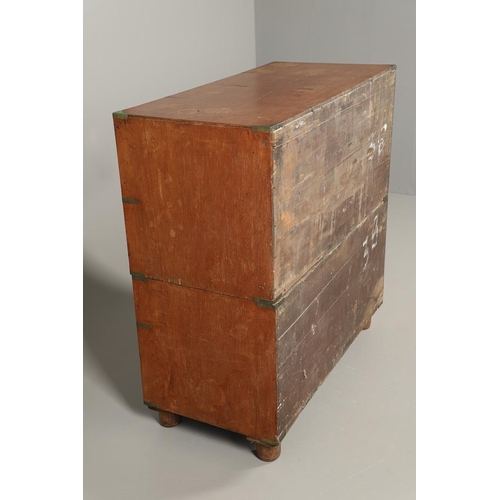 490 - A 19TH CENTURY TEAK CAMPAIGN CHEST. with central secretaire drawer enclosing a burr oak veneered int... 