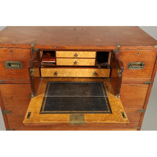 490 - A 19TH CENTURY TEAK CAMPAIGN CHEST. with central secretaire drawer enclosing a burr oak veneered int... 