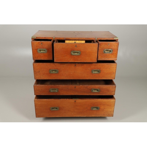 490 - A 19TH CENTURY TEAK CAMPAIGN CHEST. with central secretaire drawer enclosing a burr oak veneered int... 