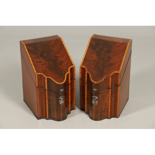 491 - A PAIR OF GEORGE III MAHOGANY KNIFE BOXES. of serpentine form, crossbanded with satinwood, the inter... 