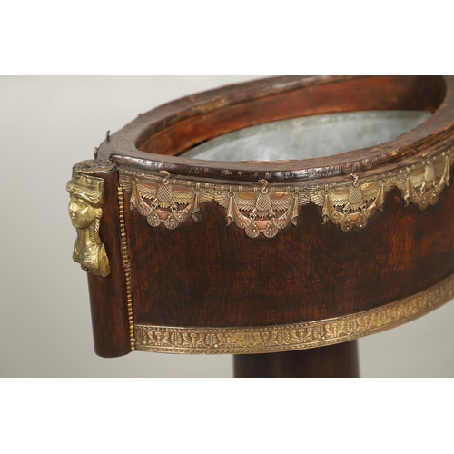 493 - AN EMPIRE STYLE ROSEWOOD JARDINIERE STAND. of elliptical form, the original tin liner upon a cylindr... 