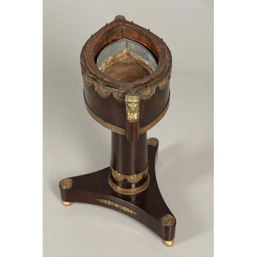 493 - AN EMPIRE STYLE ROSEWOOD JARDINIERE STAND. of elliptical form, the original tin liner upon a cylindr... 