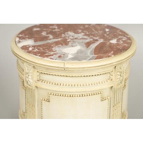 495 - A PAIR OF FRENCH MARBLE TOP PAINTED POT CUPBOARDS. of cylindrical form with moulded Classical motif ... 