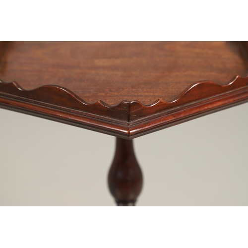 496 - A GEORGE III MAHOGANY PEDESTAL WINE TABLE. the galleried six sided top upon a turned column and trip... 