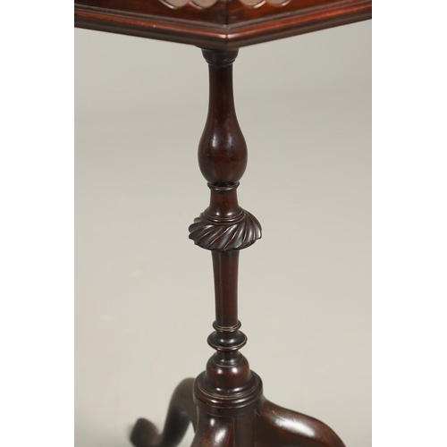 496 - A GEORGE III MAHOGANY PEDESTAL WINE TABLE. the galleried six sided top upon a turned column and trip... 