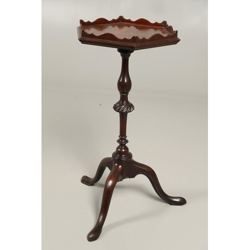 496 - A GEORGE III MAHOGANY PEDESTAL WINE TABLE. the galleried six sided top upon a turned column and trip... 