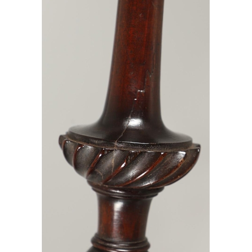 496 - A GEORGE III MAHOGANY PEDESTAL WINE TABLE. the galleried six sided top upon a turned column and trip... 