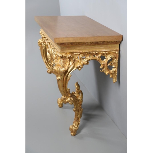 500 - A LOUIS XVI STYLE GILTWOOD CONSOLE TABLE. the solid wood top over an ornate frieze with central C sc... 