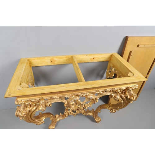 500 - A LOUIS XVI STYLE GILTWOOD CONSOLE TABLE. the solid wood top over an ornate frieze with central C sc... 