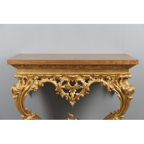 500 - A LOUIS XVI STYLE GILTWOOD CONSOLE TABLE. the solid wood top over an ornate frieze with central C sc... 