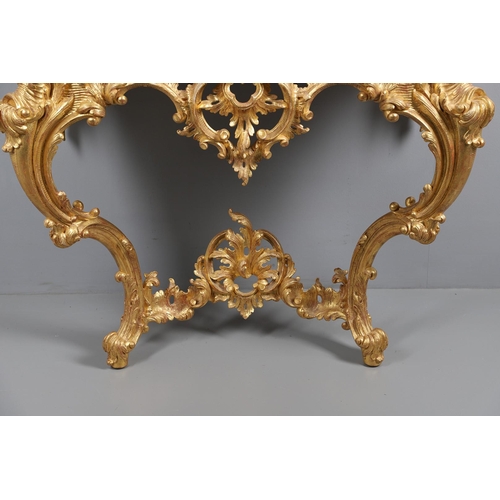 500 - A LOUIS XVI STYLE GILTWOOD CONSOLE TABLE. the solid wood top over an ornate frieze with central C sc... 