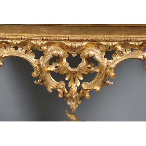 500 - A LOUIS XVI STYLE GILTWOOD CONSOLE TABLE. the solid wood top over an ornate frieze with central C sc... 