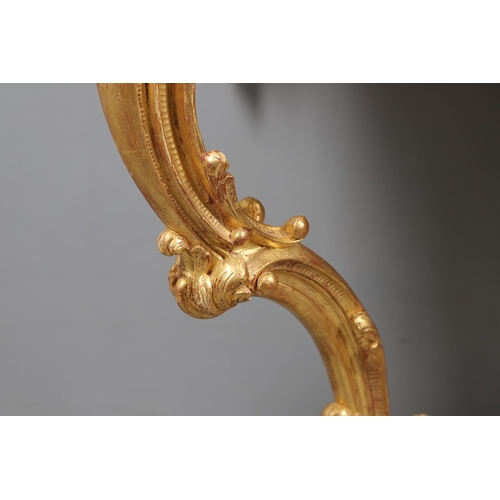 500 - A LOUIS XVI STYLE GILTWOOD CONSOLE TABLE. the solid wood top over an ornate frieze with central C sc... 