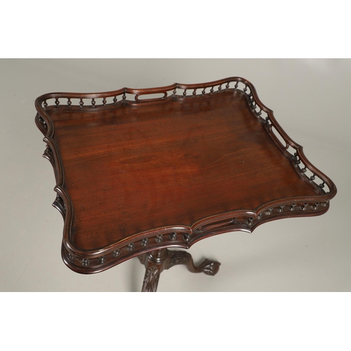 501 - A GEORGE III STYLE MAHOGANY TRAY TOP TRIPOD TABLE. the rectangular galleried tilt top upon a slender... 