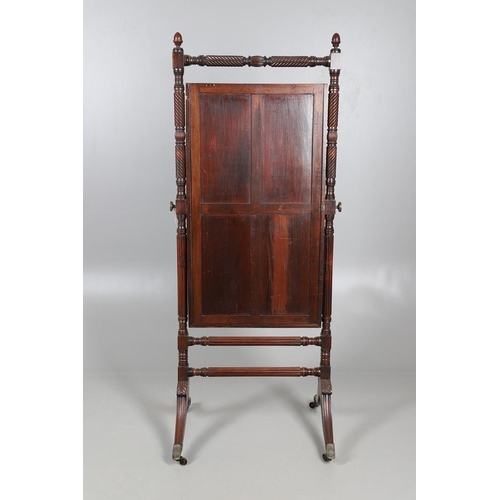 503 - A REGENCY MAHOGANY CHEVAL MIRROR. the frame with turned spiral and flower head detail and acorn fini... 