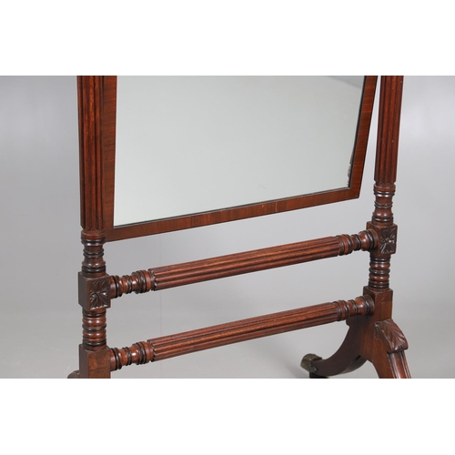 503 - A REGENCY MAHOGANY CHEVAL MIRROR. the frame with turned spiral and flower head detail and acorn fini... 