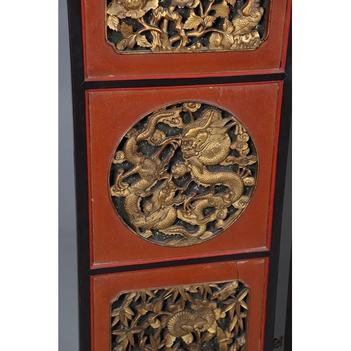 509 - A CHINESE CARVED AND LACQUERED SIX FOLD SCREEN. early 20th century, each red and black lacquered pan... 