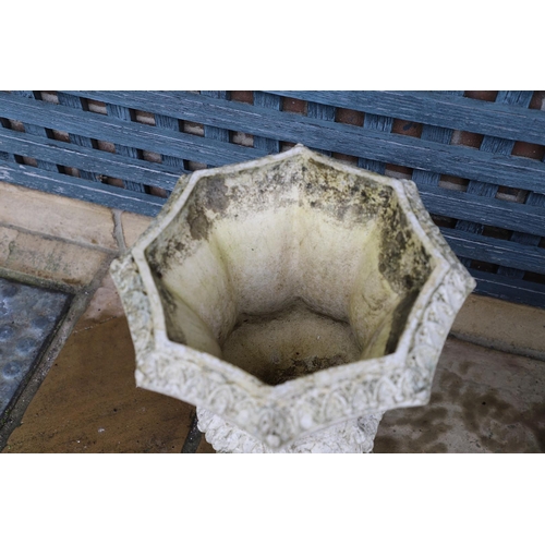 513 - A PAIR OF FRENCH PAINTED BUFF TERRACOTTA URNS. of Gothic architectural form, the octagonal rims to r... 