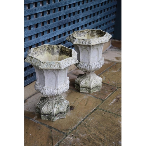 513 - A PAIR OF FRENCH PAINTED BUFF TERRACOTTA URNS. of Gothic architectural form, the octagonal rims to r... 