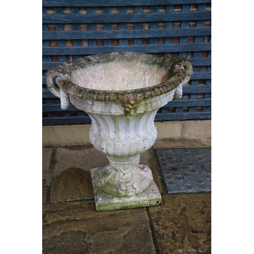 515 - A PAIR OF PAINTED COMPOSITE MARBLE CAMPANA STYLE URNS. the flaring, fluted body with a pair of rope ... 