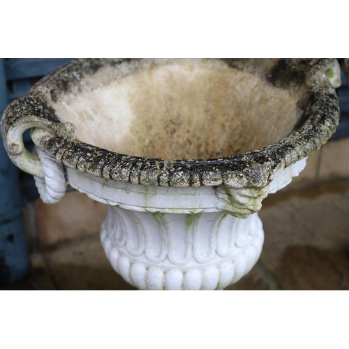 515 - A PAIR OF PAINTED COMPOSITE MARBLE CAMPANA STYLE URNS. the flaring, fluted body with a pair of rope ... 