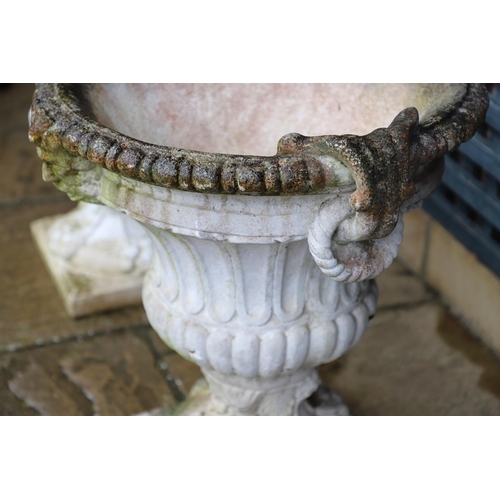 515 - A PAIR OF PAINTED COMPOSITE MARBLE CAMPANA STYLE URNS. the flaring, fluted body with a pair of rope ... 