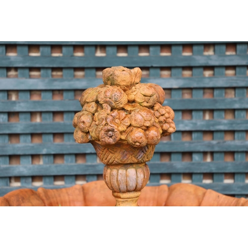 516 - A VICTORIAN STYLE COMPOSITE STONE FOUNTAIN. with terracotta finish, the central column moulded as fr... 