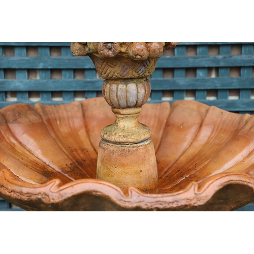 516 - A VICTORIAN STYLE COMPOSITE STONE FOUNTAIN. with terracotta finish, the central column moulded as fr... 