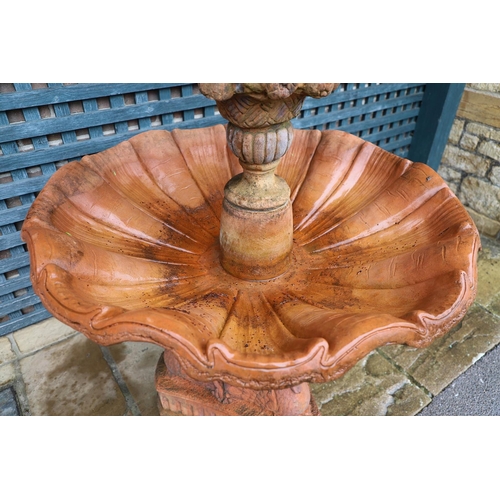 516 - A VICTORIAN STYLE COMPOSITE STONE FOUNTAIN. with terracotta finish, the central column moulded as fr... 