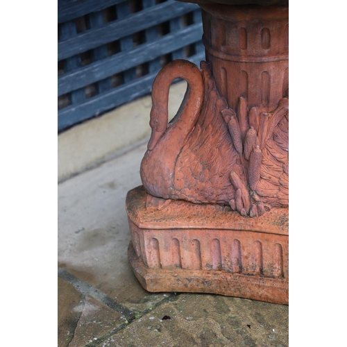 516 - A VICTORIAN STYLE COMPOSITE STONE FOUNTAIN. with terracotta finish, the central column moulded as fr... 