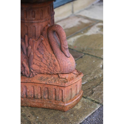 516 - A VICTORIAN STYLE COMPOSITE STONE FOUNTAIN. with terracotta finish, the central column moulded as fr... 