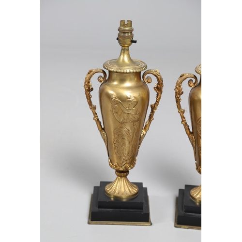 518 - A PAIR OF LATE 19TH/EARLY 20TH CENTURY GILT METAL TABLE LAMPS. modelled as Classical urns, each with... 