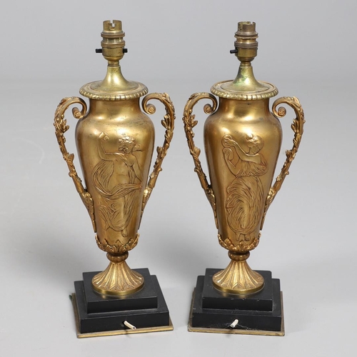 518 - A PAIR OF LATE 19TH/EARLY 20TH CENTURY GILT METAL TABLE LAMPS. modelled as Classical urns, each with... 