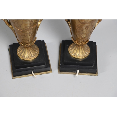 518 - A PAIR OF LATE 19TH/EARLY 20TH CENTURY GILT METAL TABLE LAMPS. modelled as Classical urns, each with... 