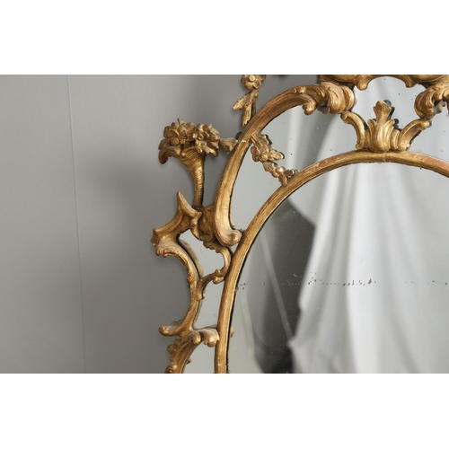 519 - A LATE 18TH CENTURY GILTWOOD SECTIONAL WALL MIRROR. the ornate frame carved in the Rococo style as f... 