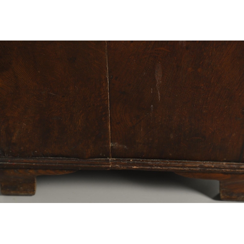 526 - A GEORGE III OAK DRESSER BASE. the double plank top over seven drawers and central shelved ogee pane... 