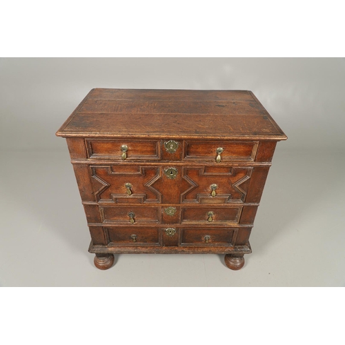 528 - A LATE 17TH CENTURY OAK CHEST OF DRAWERS. the triple plank top to panelled sides and four long panel... 