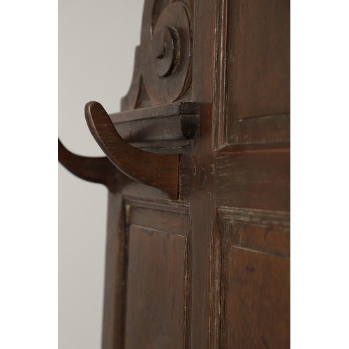 529 - A LARGE CARVED OAK COUNTRY HOUSE HALLSTAND. with a shaped cornice and panel back, carved Lion masks ... 